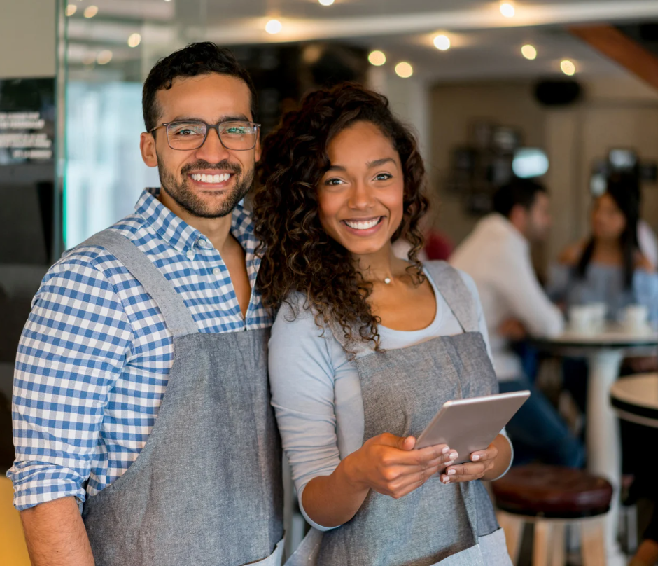 two couple business owners smiling